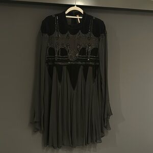 Free people evening mini dress beaded design. Never worn.